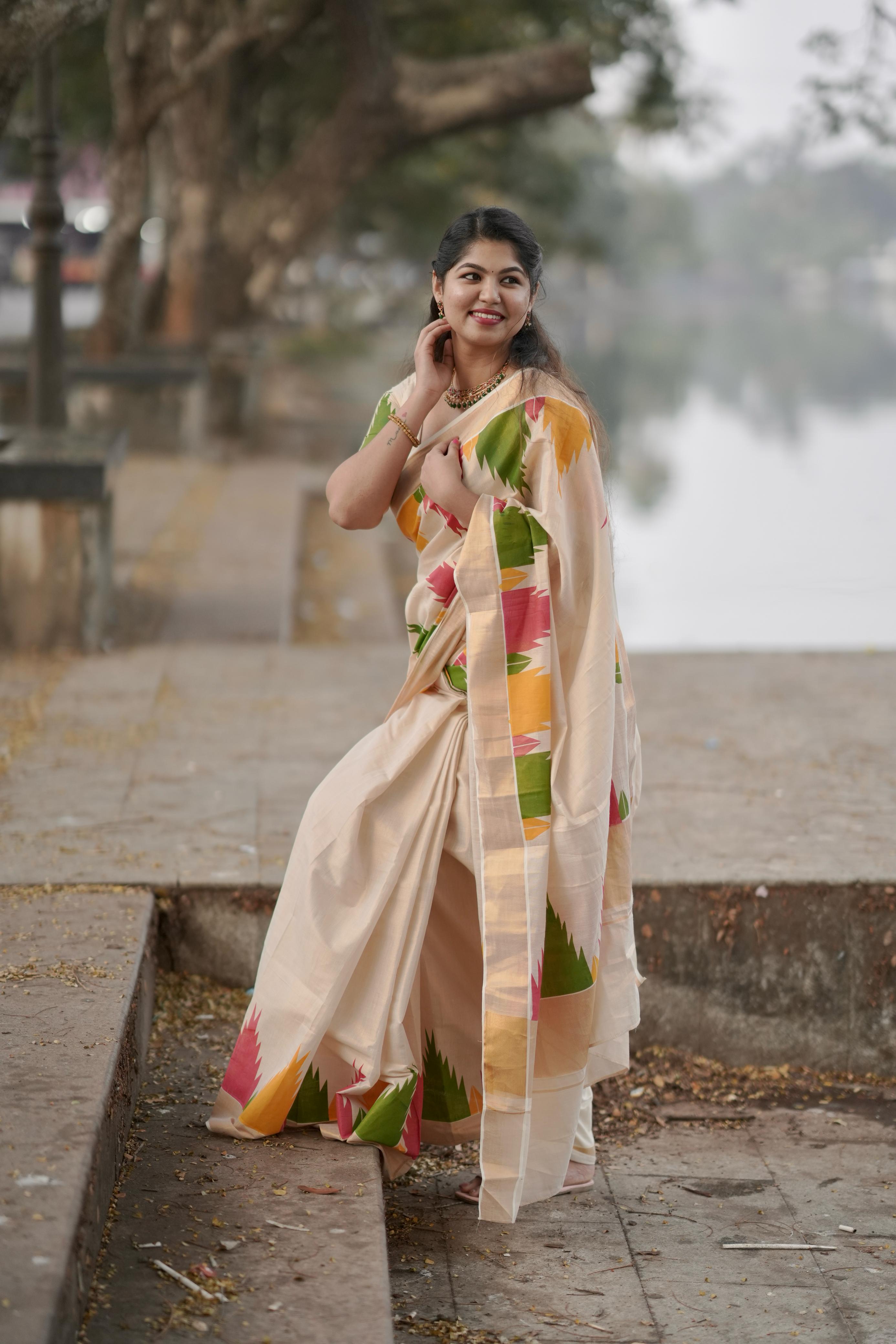Multi colour temple golden tissue saree